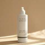 Terra Green hand soap bottle on a beige background
