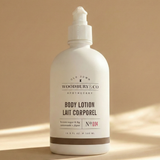 Body lotion bottle with 'Woodbury & Co' branding on a beige background