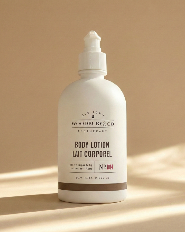 Body lotion bottle with 'Woodbury & Co' branding on a beige background
