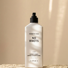 Kenneth Cole No Knots conditioner bottle on a beige background