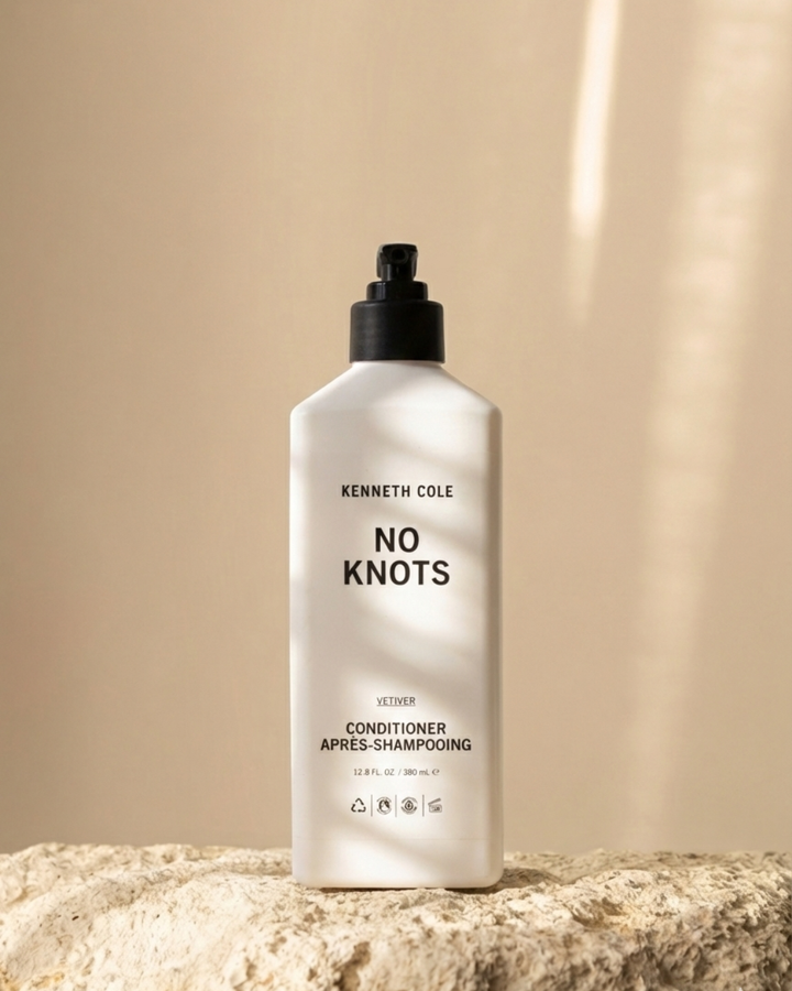 Kenneth Cole No Knots conditioner bottle on a beige background