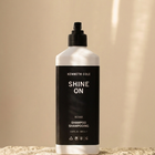 Shampoo bottle labeled 'Shine On' by Kenneth Cole on a beige background