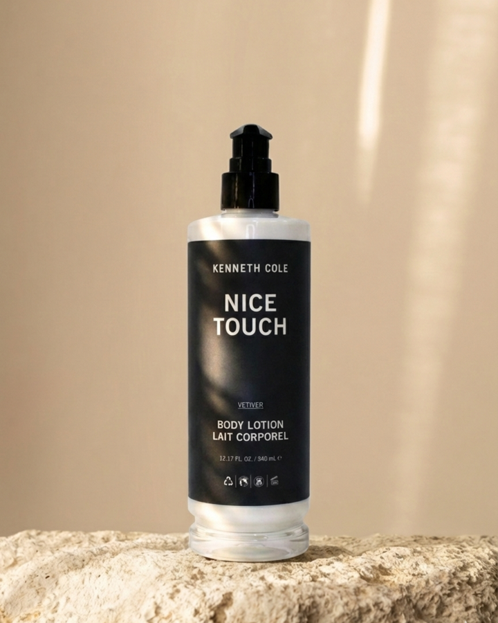 Kenneth Cole Nice Touch body lotion bottle on a beige background