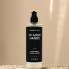 Bottle of Kenneth Cole hand wash on a beige background
