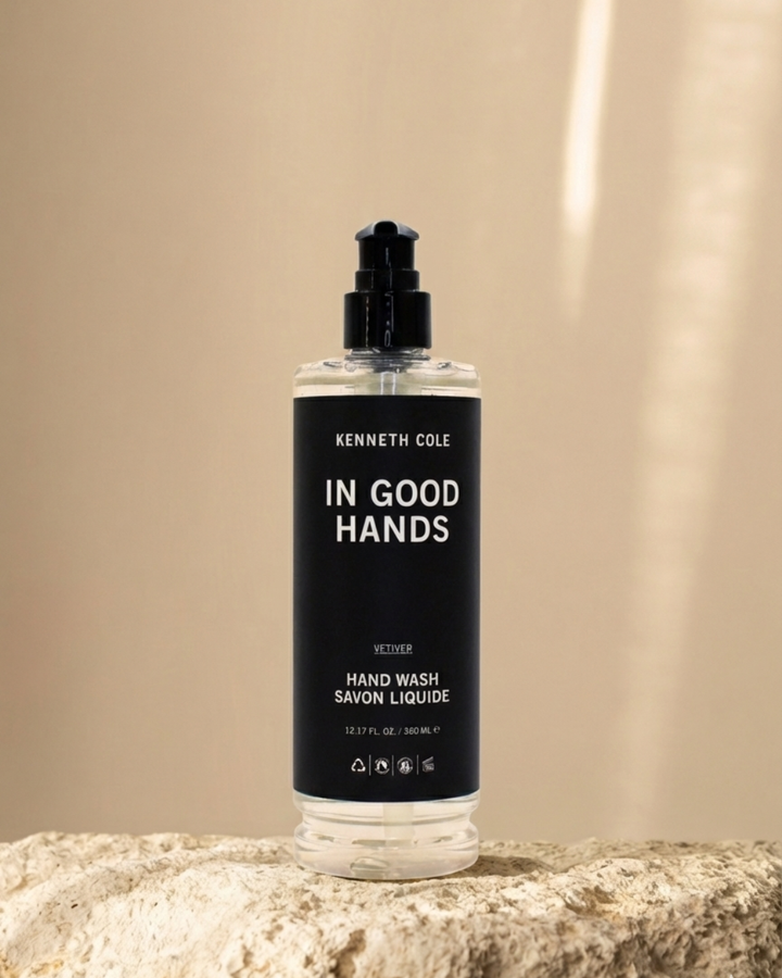 Bottle of Kenneth Cole hand wash on a beige background