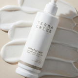 Terra Green moisturizer bottle on a textured beige background