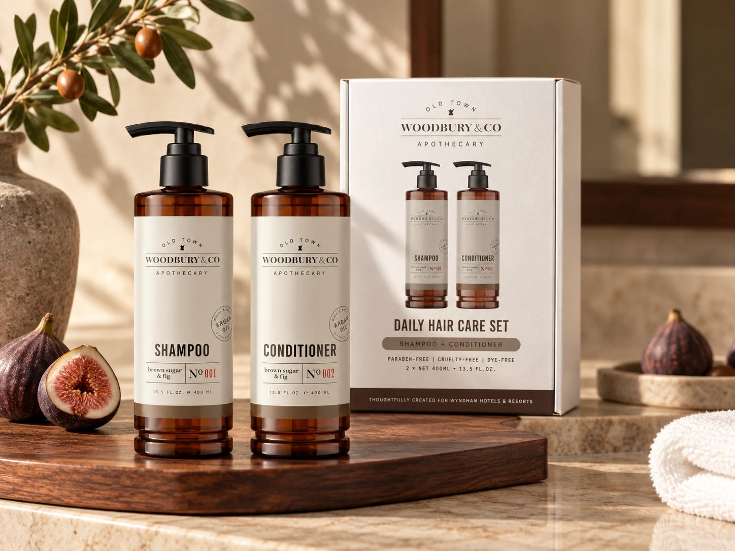 Woodbury and Co. Brown Sugar and Fig take-home collection in a hotel bathroom