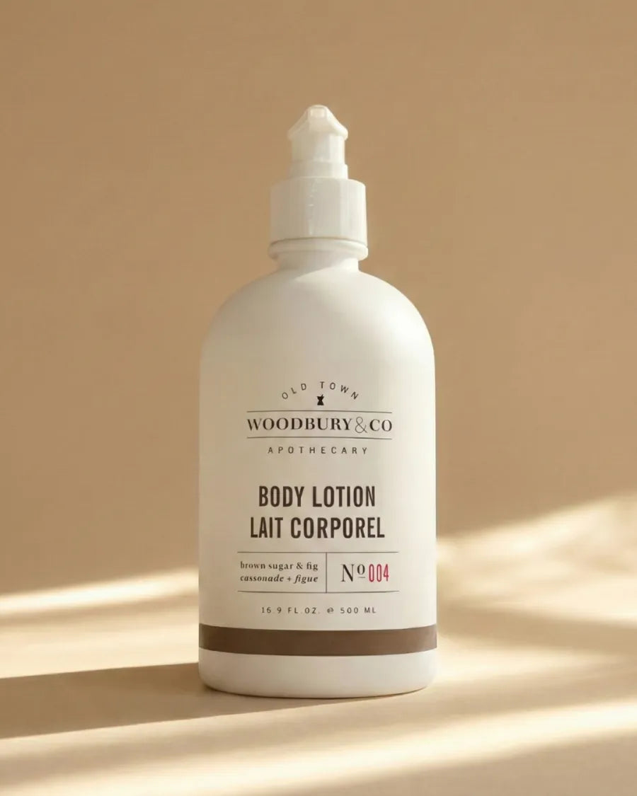 Woodbury & Co body lotion bottle on a warm neutral background